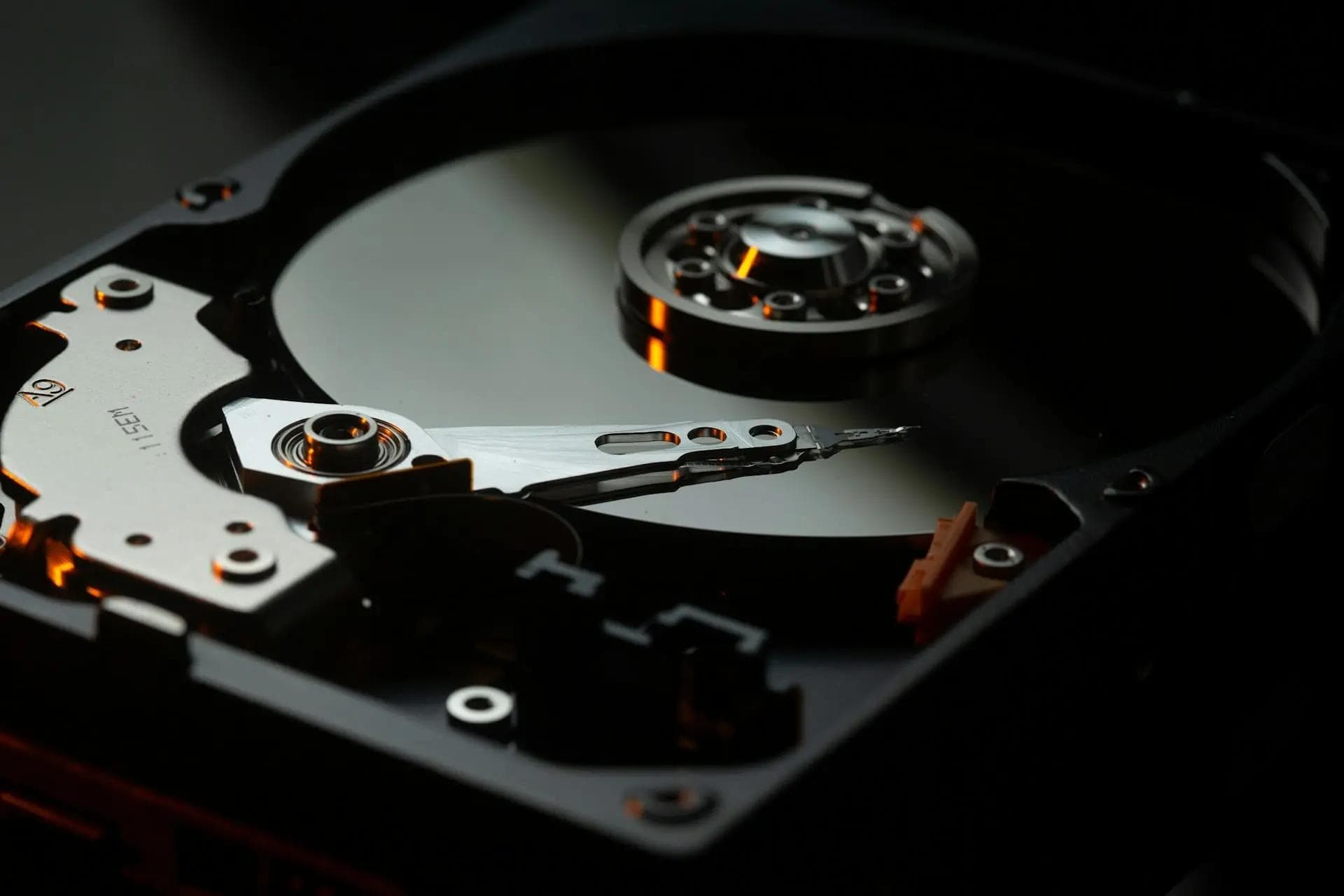 Bokeh extreme close-up of a mechanical hard-drive's internal structure in a 2.5 inch form factor
